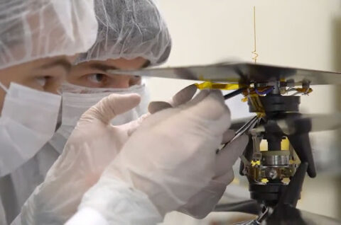 JPL scientists attach the 1903 wing fabric to Ingenuity
