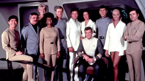 The crew of the Enterprise in "Star Trek: The Motion Picture": left to right, Sulu (George Takei), Scott (James Doohan), Rand (Grace Lee Whitney), Uhura (Nichelle Nichols), Decker (Stephen Collins), McCoy (DeForest Kelley), Chapel (Majel Barrett), Kirk (William Shatner), Spock (Leonard Nimoy), Ilia (Persis Khambatta), Chekov (Walter Koenig) - {image via Paramount}